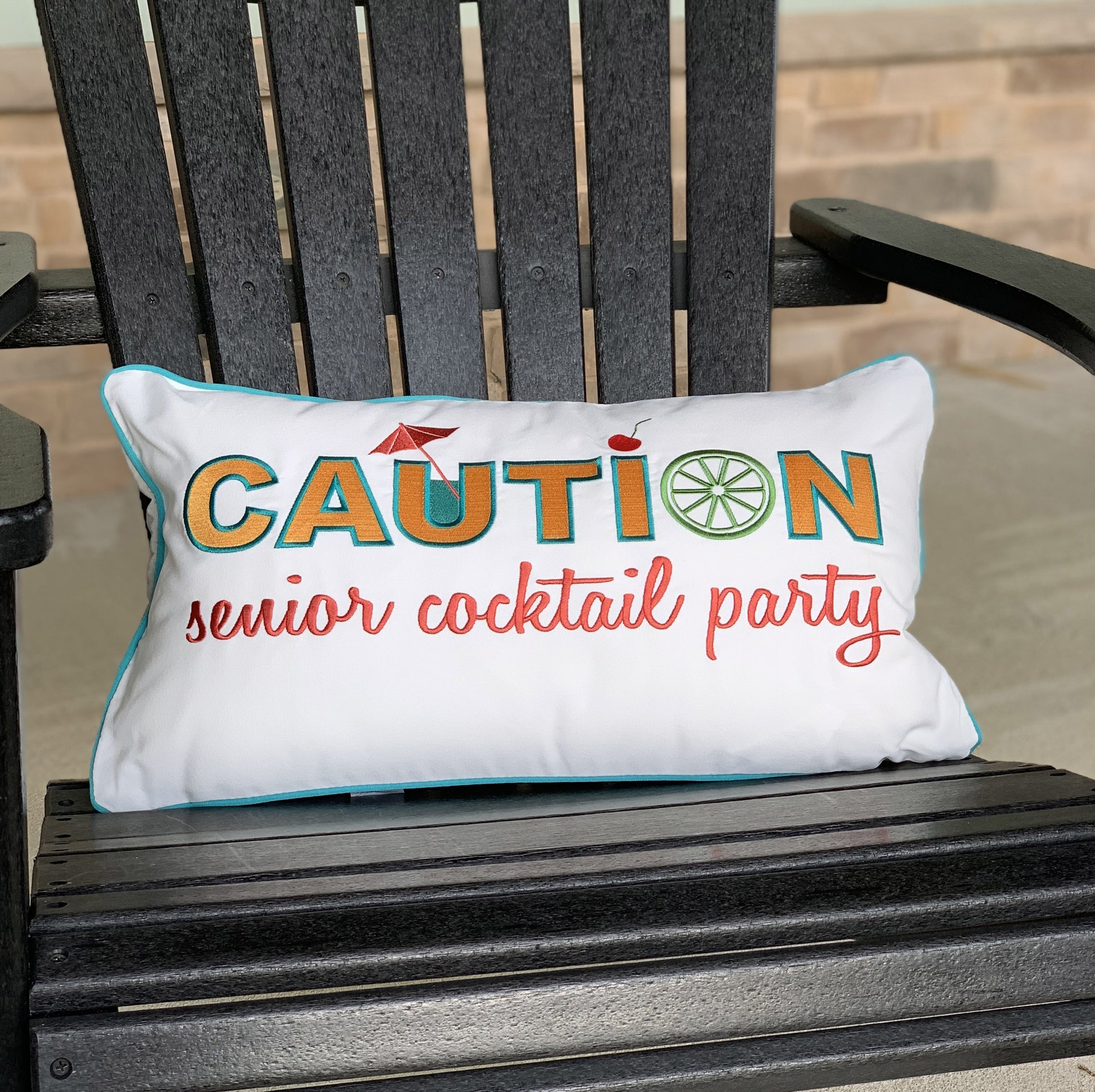 Caution Senior Cocktail Party pillow styled on an Adirondack chair.